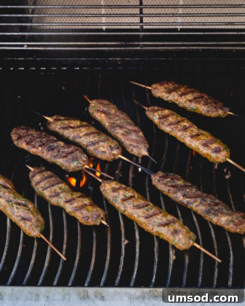 Urfa Kebab Excellence 6 An array of delicious Urfa kebabs resting on metal skewers after grilling, ready to be served