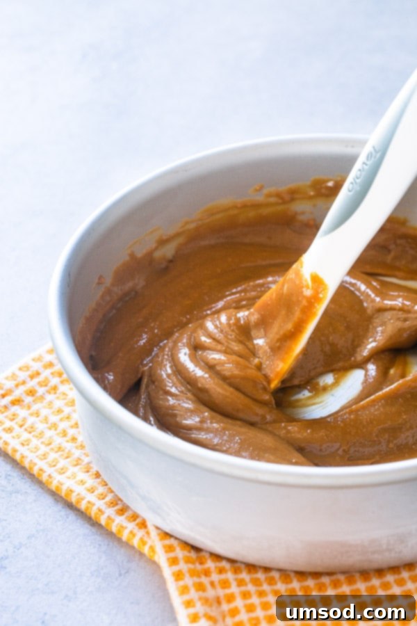 Dulce de leche being stirred in a bowl