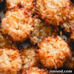 Effortless Mexican Coconut Cocadas Three Ingredients 9 A close-up shot of a pile of cocadas, golden brown and inviting.