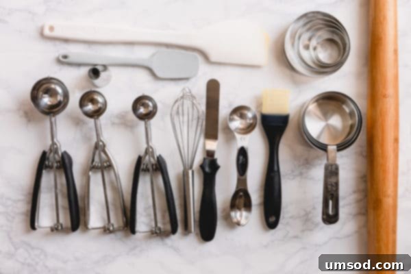 Start Baking Right The 22 Essentials Every Beginner Needs 2 Essential baking tools laid out on a kitchen counter