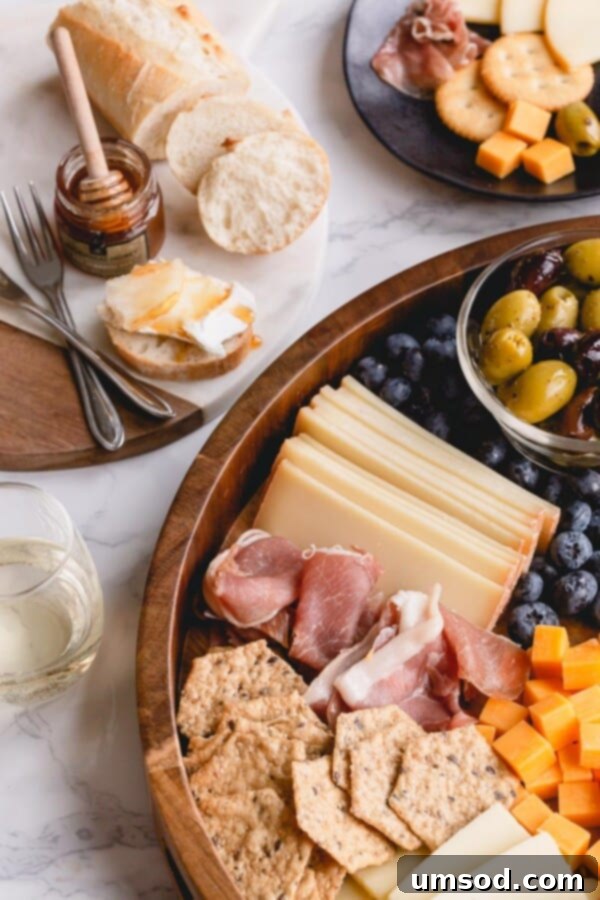 Crafting the Ultimate Charcuterie and Cheese Board 5 Elegant charcuterie board overflowing with folded cured meats, fresh berries, sliced fruit, and crunchy nuts