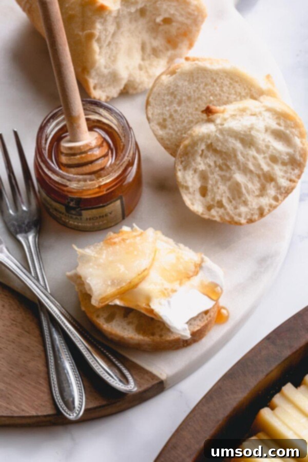 Crafting the Ultimate Charcuterie and Cheese Board 8 Completed opulent charcuterie and cheese board ready for guests, brimming with a rich variety of delicacies