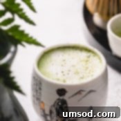 Mastering the Matcha Latte 15 A small cup of vibrant green matcha latte, symbolizing a delightful homemade beverage.
