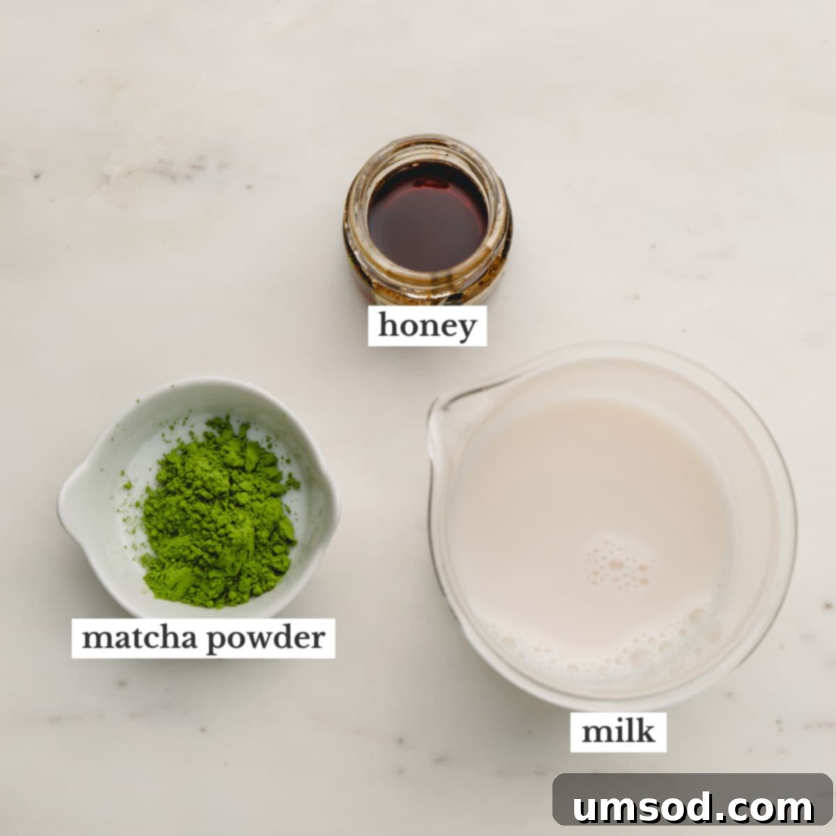 Mastering the Matcha Latte 5 Individual bowls displaying key ingredients for a matcha latte: vibrant green matcha powder, golden honey, and a glass of almond milk.