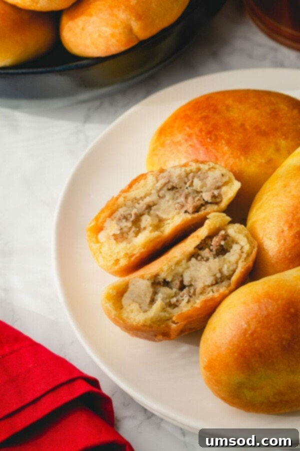 Traditional Russian Baked Meat Pirozhki 3 Close-up of baked pirozhki dough rising in a bowl.