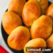 Traditional Russian Baked Meat Pirozhki 9 A small bowl of pirozhki, ready to be served.