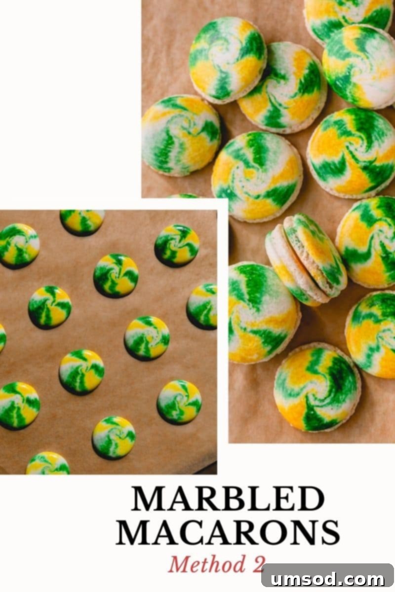 Two vibrant, tie-dye marbled macarons showcasing striking stripes of color.