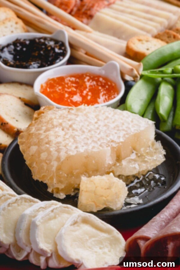 The completed spring charcuterie board, fully assembled with all ingredients, ready for serving.