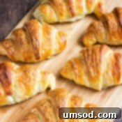 Flaky Homemade Croissants 13 A smaller image of a golden croissant.