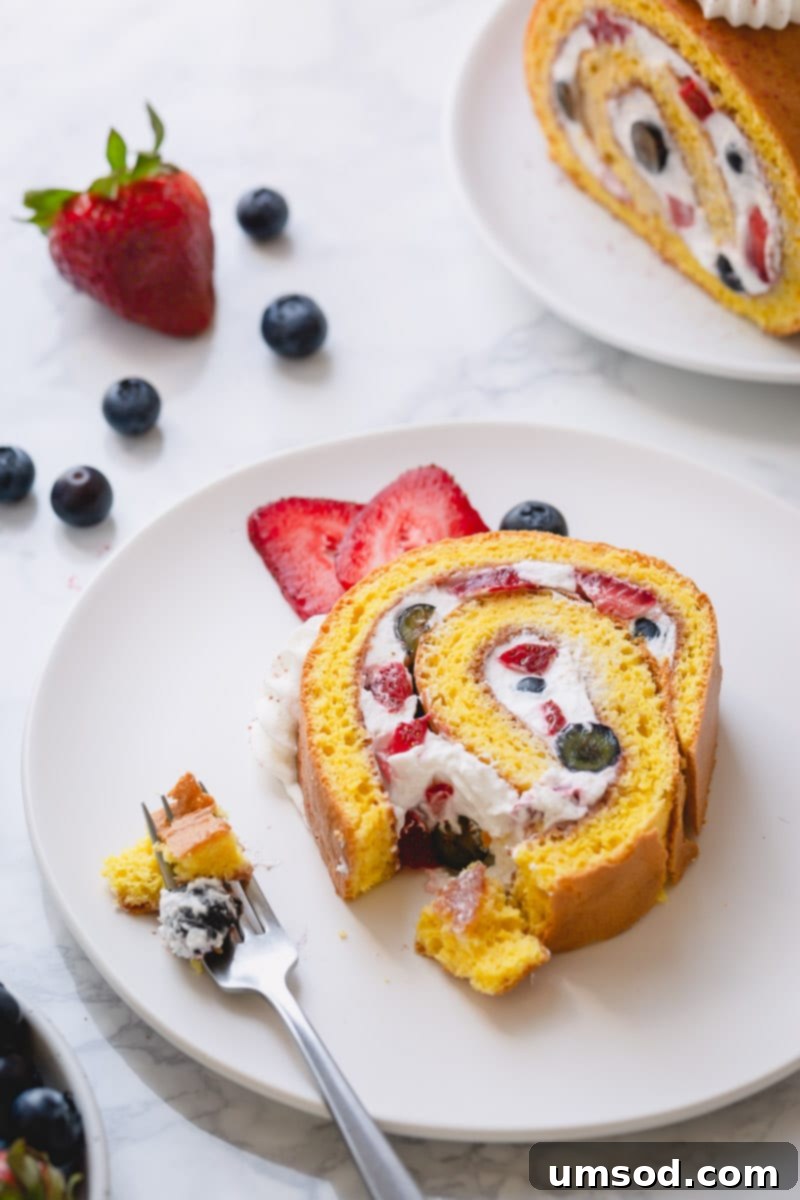 Effortlessly impressive, this simple roll cake is my go-to last minute dessert, showcasing a perfect, crack-free spiral with fresh fruit filling.