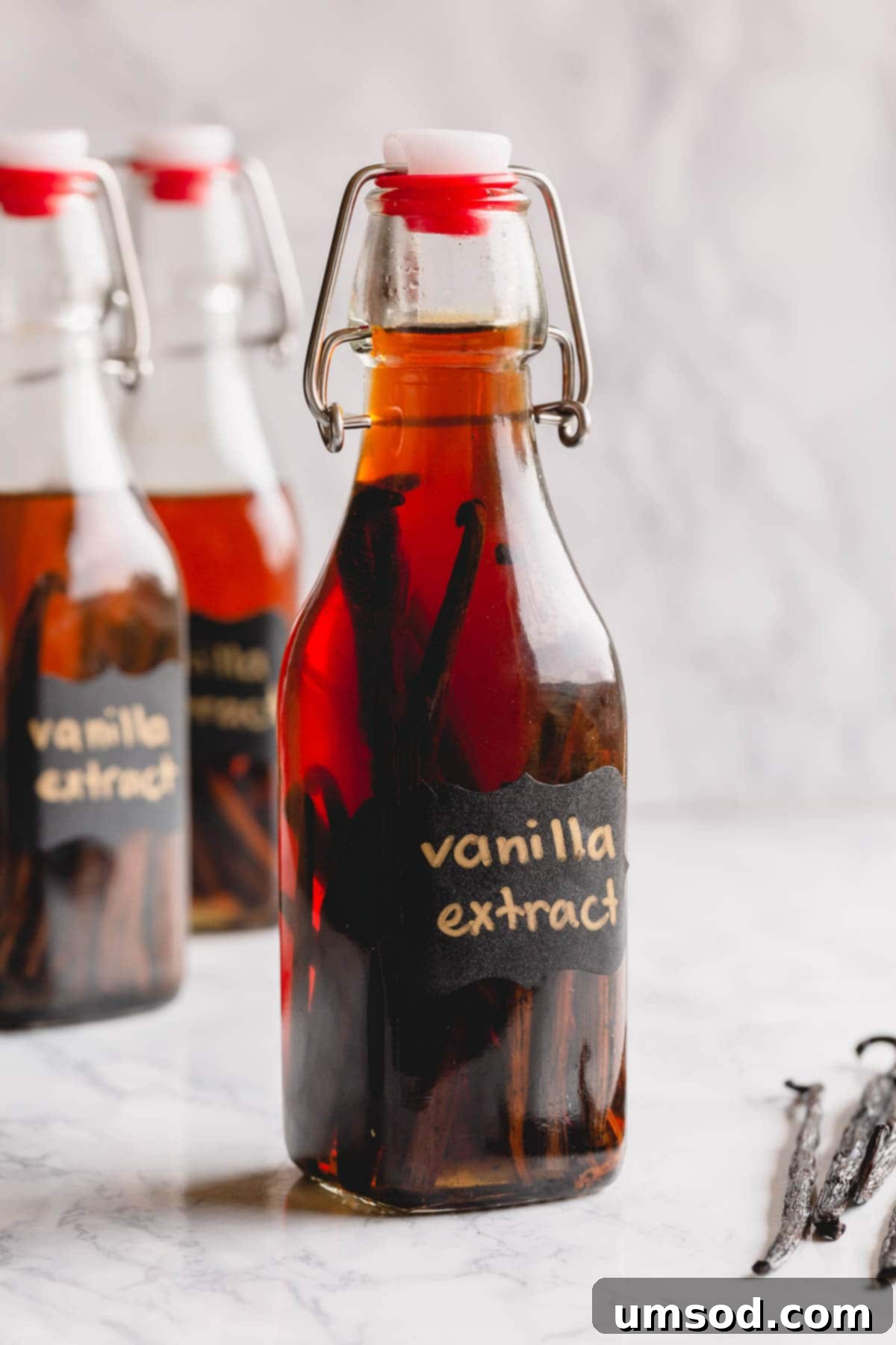Crafting Your Own Vanilla Extract 2 Homemade vanilla bean extract in a clear bottle, showcasing its rich amber color.