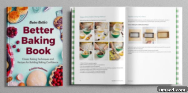 A close-up of Baker Bettie's 'Better Baking Book' showing its inviting cover with a beautifully frosted cake.