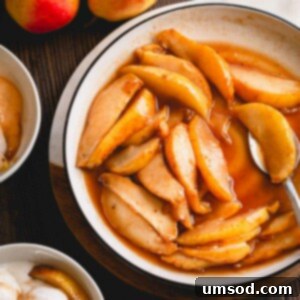 Caramelized pear slices with sauce in a white plate.