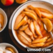 Caramelized pear slices with sauce in a white plate.