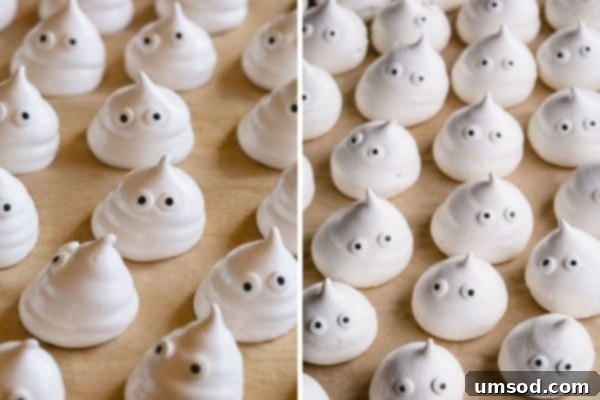 Ghostly Meringue Delights 6 A close-up of finished meringue ghosts with candy eyes arranged on a rustic wooden surface, showing their delicate, airy texture.