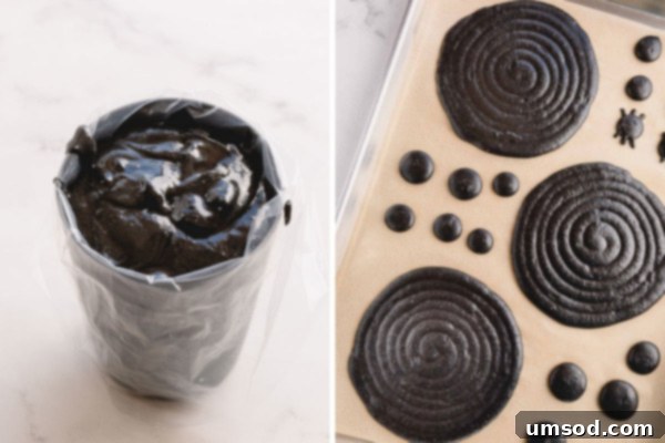 Perfectly piped black macaron batter rounds on a baking sheet, ready for baking.