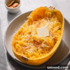 Spaghetti Squash Made Easy: Two Delicious Ways 8 Half of baked spaghetti squash with butter and parmesan cheese.