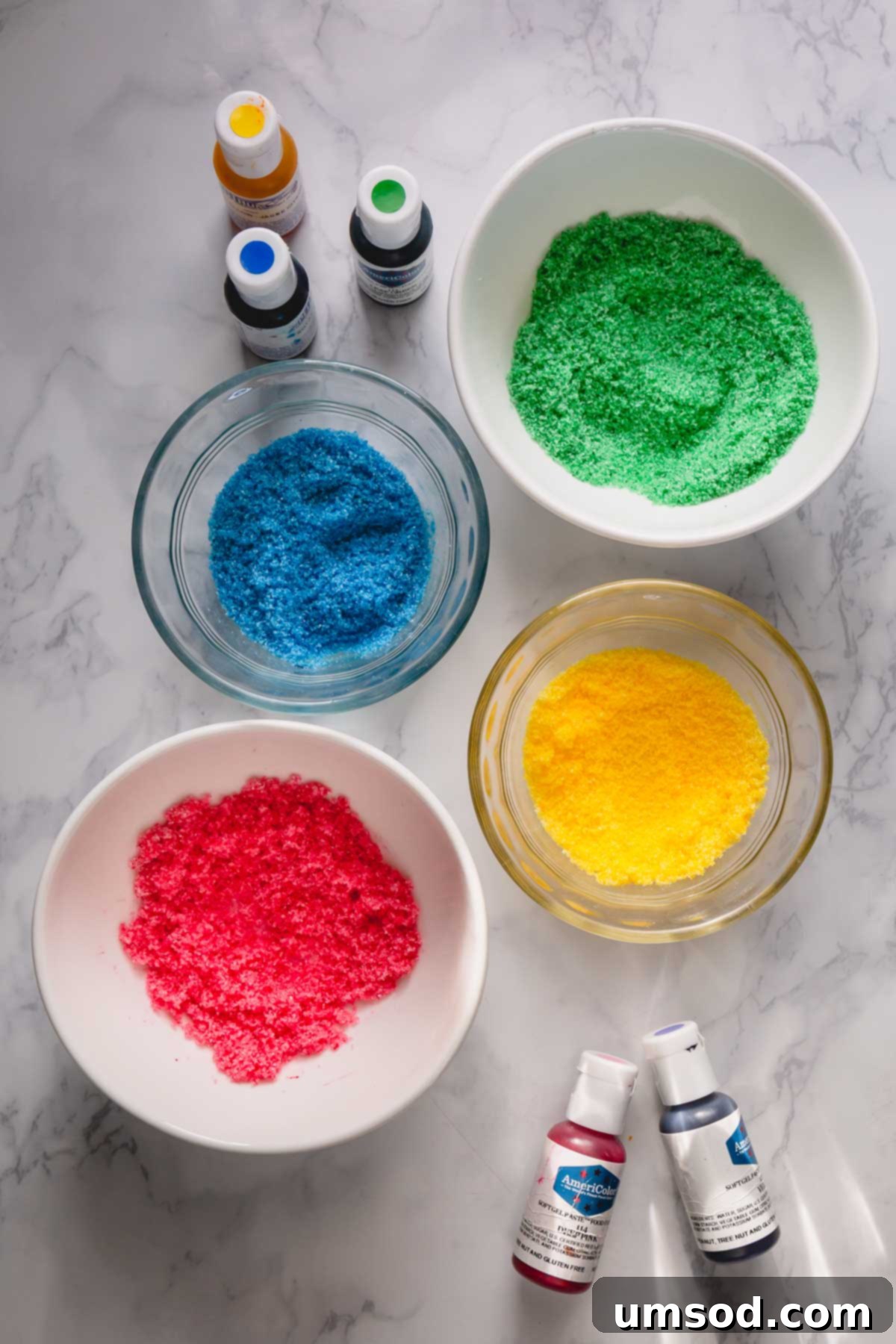 Bowls of vibrant homemade colored sugars, ready for decorating.