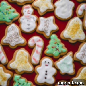 Frosted Christmas cookies on counter.