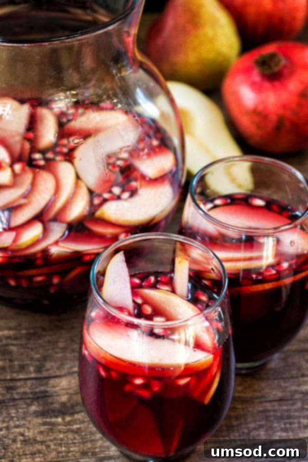 Autumn Harvest Sangria 5 My fall sangria, filled with apples, pears and pomegranates, is absolutely delicious drink you can enjoy this wonderful autumn weekend!