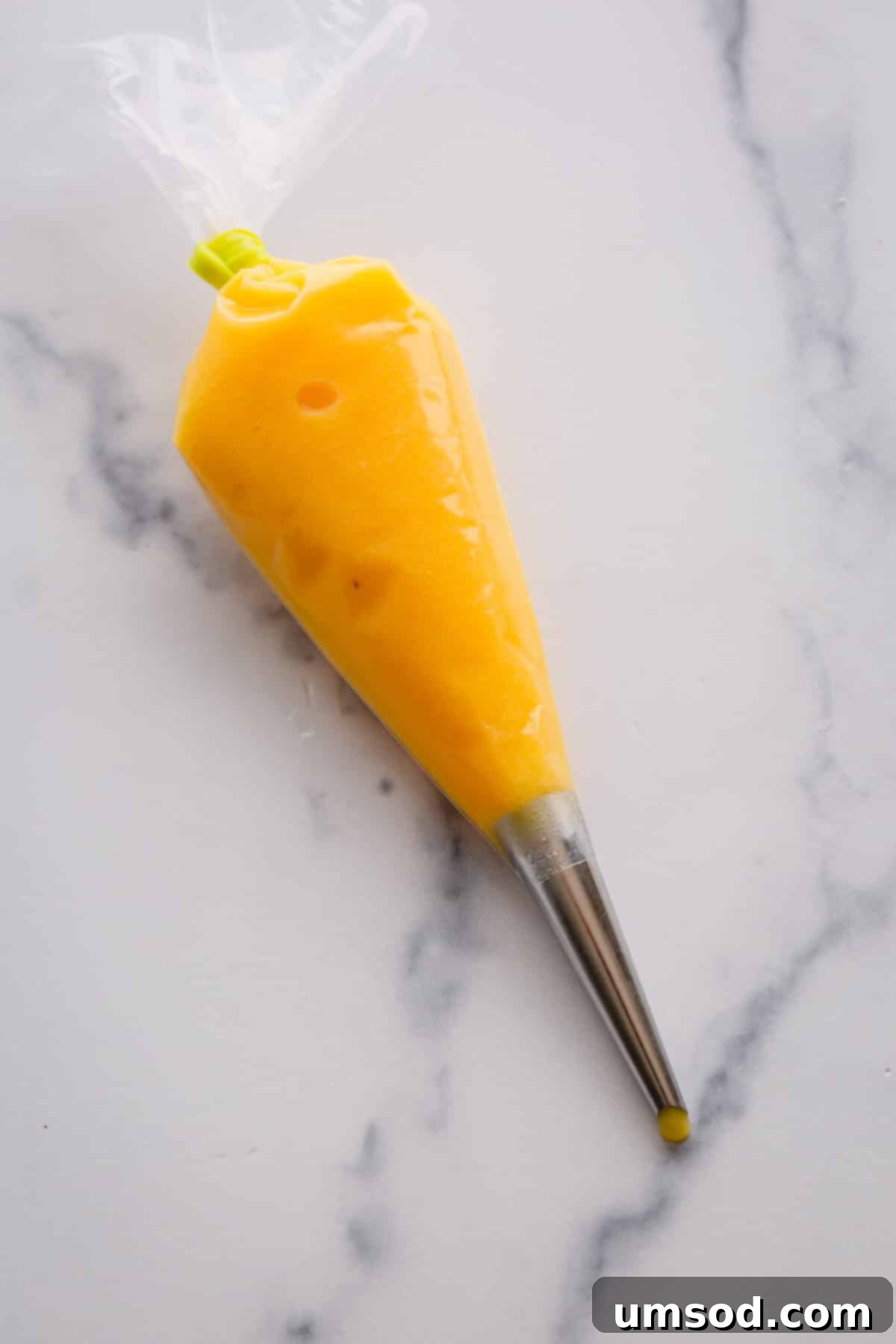 lemon curd in a piping bag.