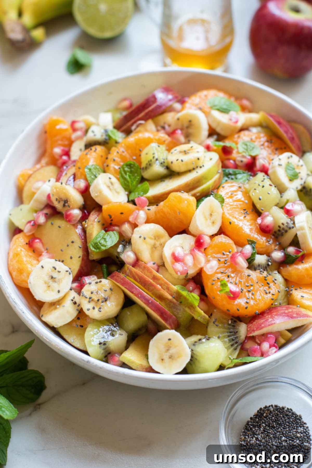 Fresh Fruit Medley 2 A beautifully arranged bowl of fresh fruit salad, glistening with honey-lime dressing.