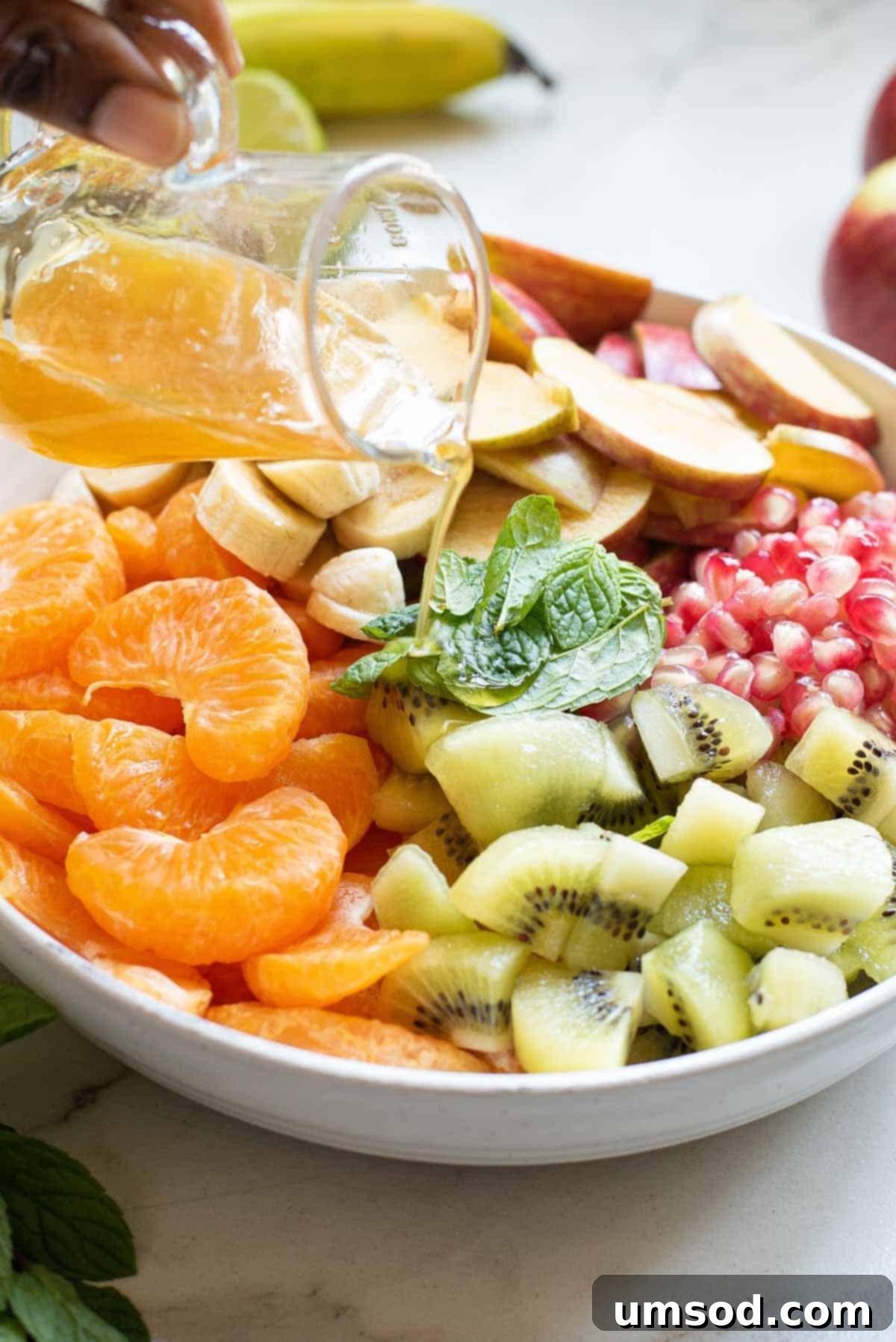 Fresh Fruit Medley 5 A close-up view of a vibrant bowl of fresh fruit salad, highlighting the textures and colors of the fruits.