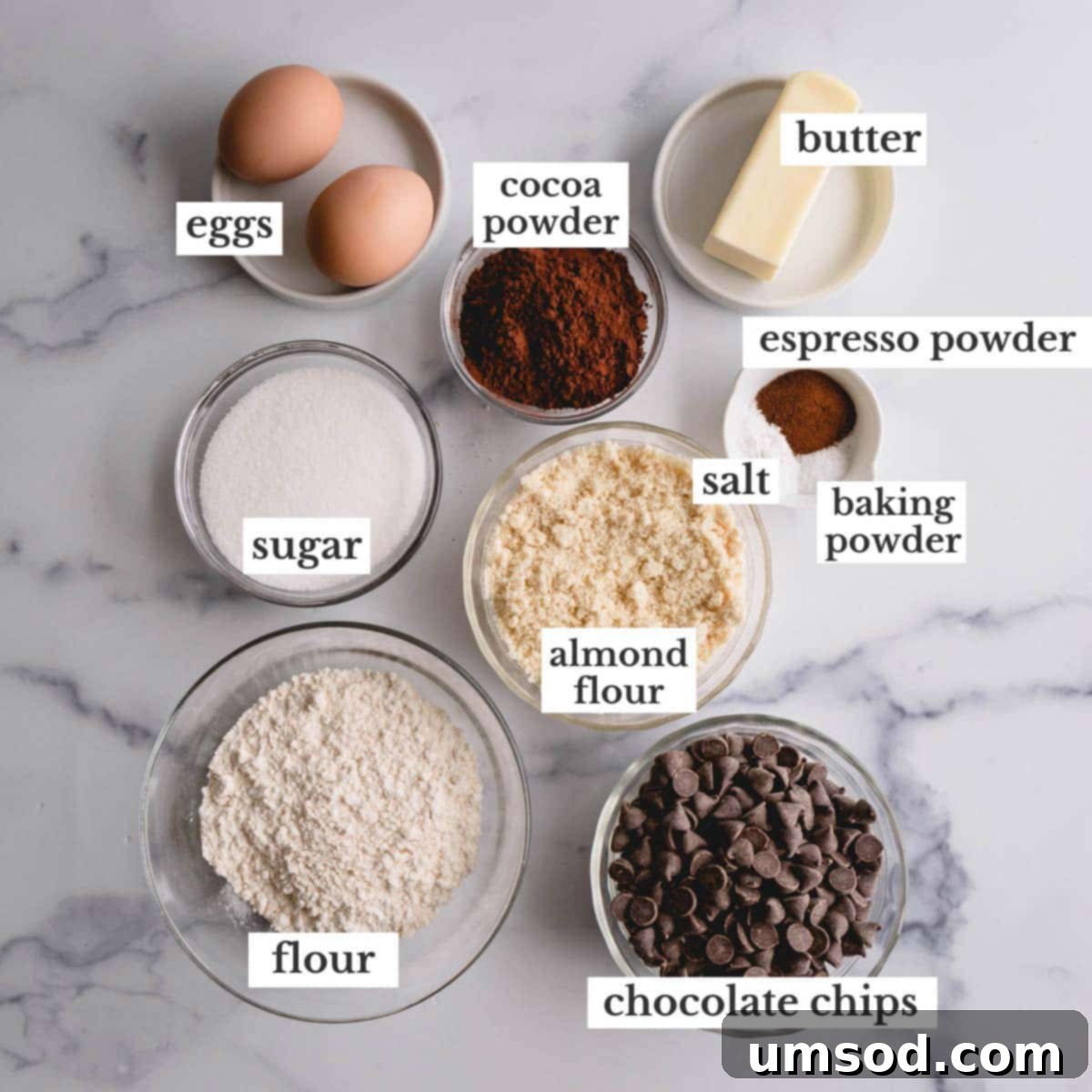 Simple Fudgy Brownie Cookies 4 Various ingredients for brownie cookies laid out on a surface.