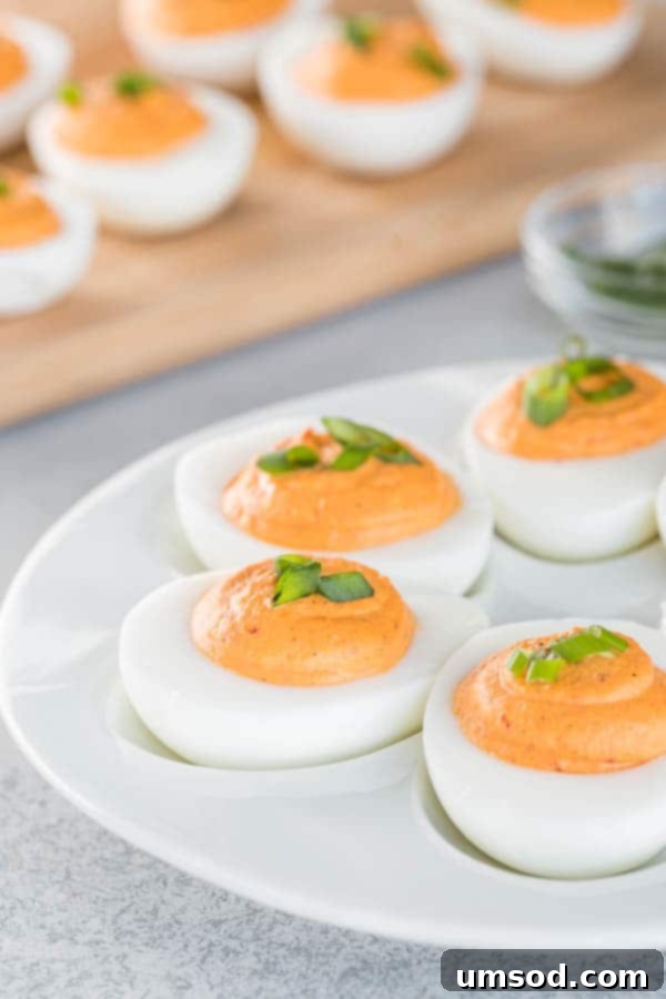 Roasted Red Pepper Deviled Eggs: creamy, smooth, and vibrant appetizer with a spicy kick.