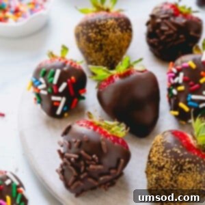 Chocolate covered strawberries coated with multi-color, chocolate, and gold sprinkles.