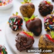 Chocolate covered strawberries coated with multi-color, chocolate, and gold sprinkles.