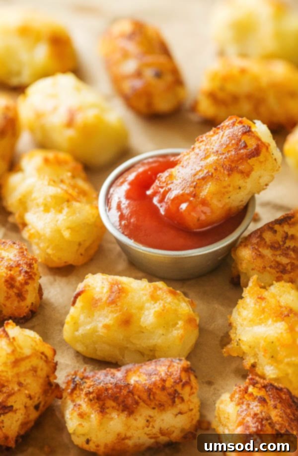 Close-up of golden homemade tater tots, showcasing their crispy texture and delicious appeal.