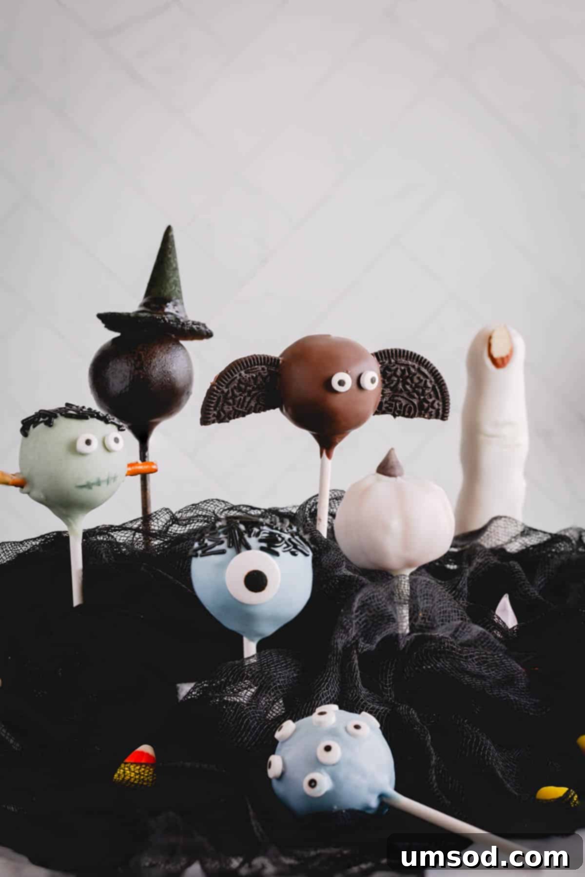 Ghoulishly Good Cake Pops 12 An array of various Halloween cake pops, showcasing diverse designs and colors.