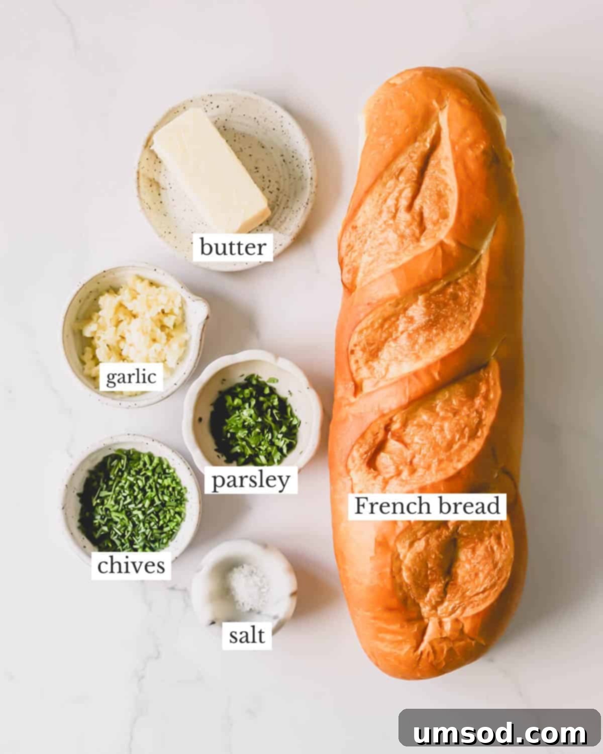 Perfect Garlic Bread in Minutes 4 Ingredients needed to make homemade garlic bread with an herbed butter spread.
