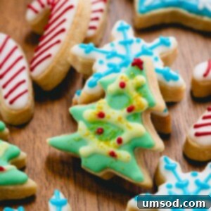 Beautifully iced Christmas sugar cookies in festive shapes like candy canes, Christmas trees, and snowflakes, ready for the holiday table.