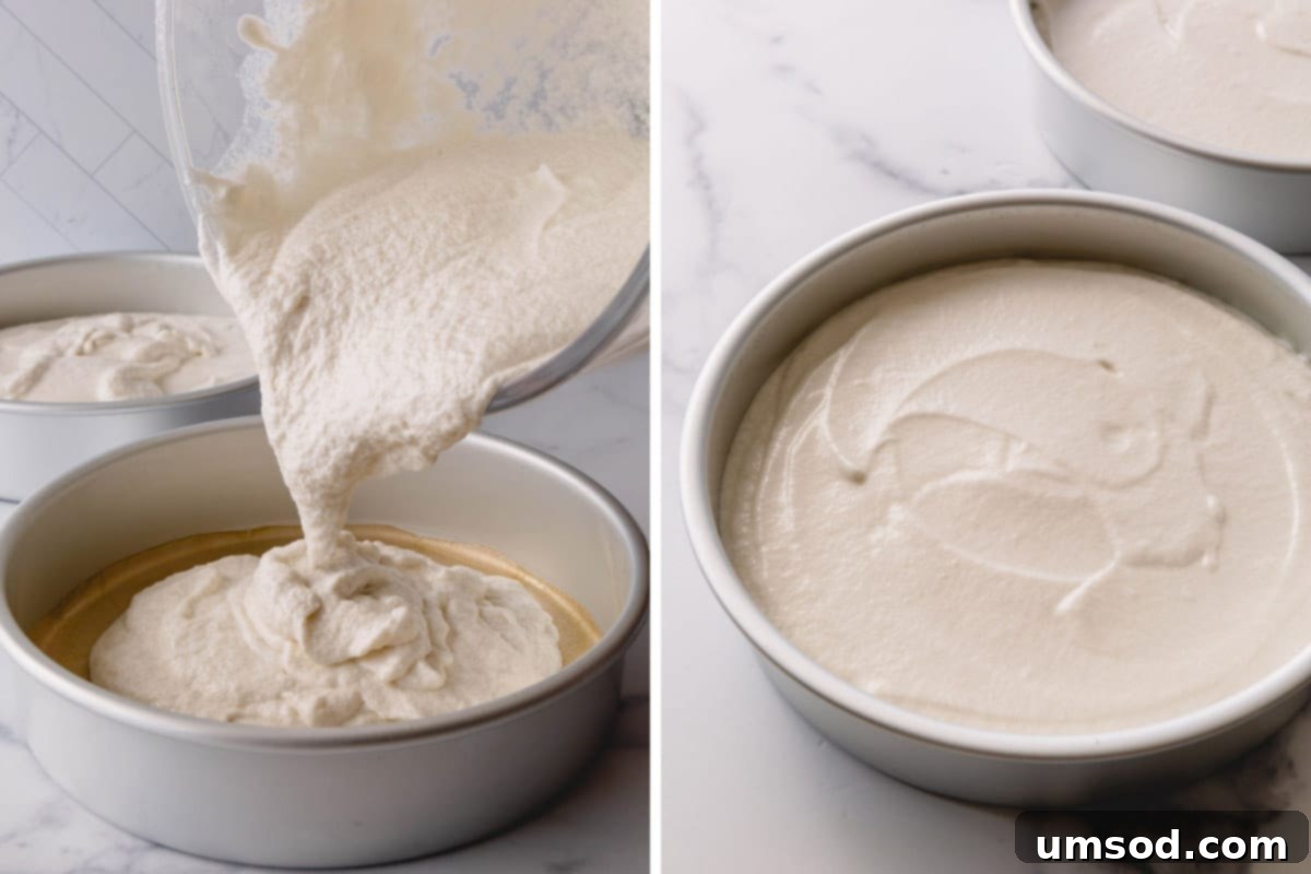Fluffy White Cake Perfection 11 Smooth white cake batter being carefully poured into two circular cake pans, ensuring even distribution for baking.