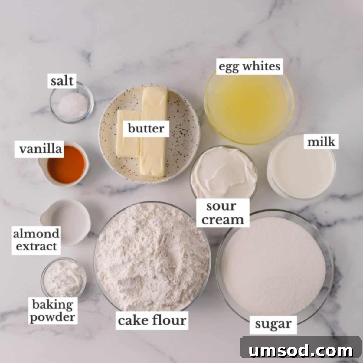 Fluffy White Cake Perfection 5 All the essential ingredients neatly arranged on a counter, ready to be used for making a classic white cake.