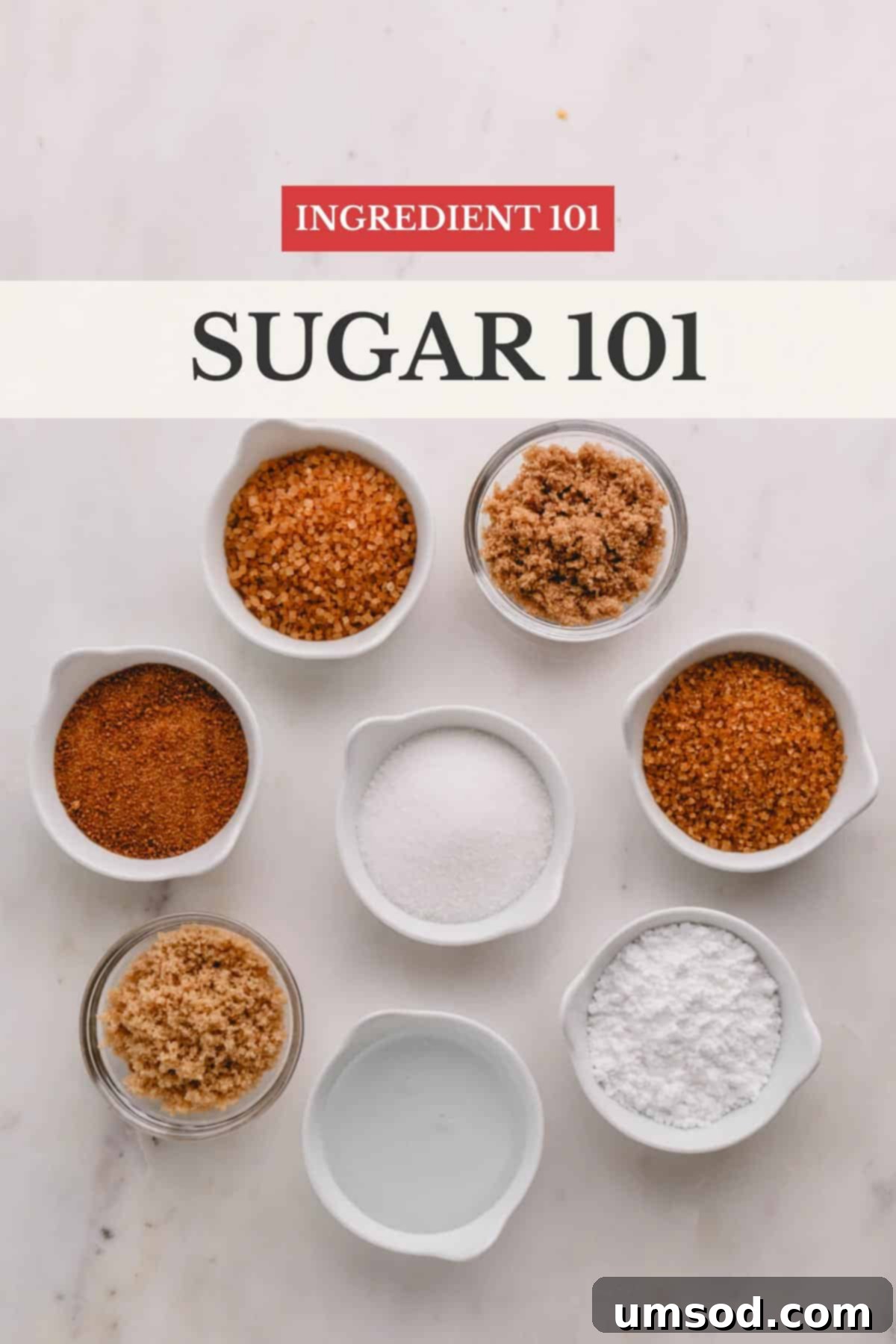 Sugar Essentials: 13 Common Types and Their Best Uses 2 An assortment of eight different types of sugar, showcasing their varying textures and colors, from fine white to coarse brown.