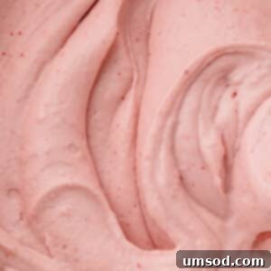 Strawberry cream cheese frosting with flecks of freeze-dried strawberries.