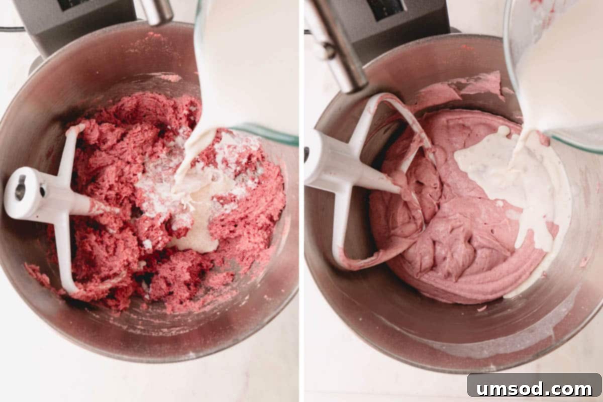 Berry Sweet Symphony 11 Strawberry cake batter being combined in a stand mixer with a whisk attachment.