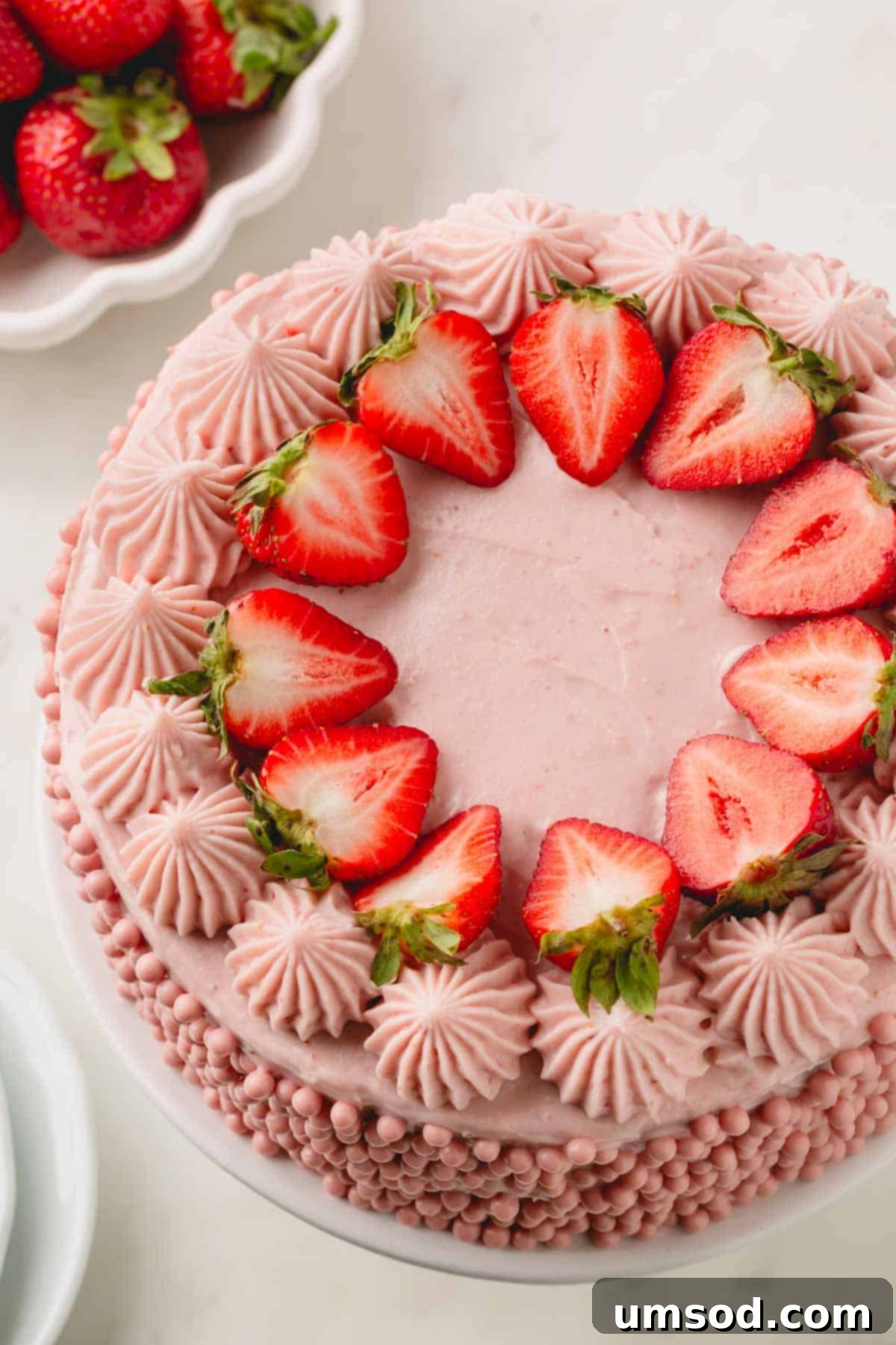 Berry Sweet Symphony 19 A layered strawberry cake with strawberry cream cheese frosting, fresh strawberries, and strawberry pearls.