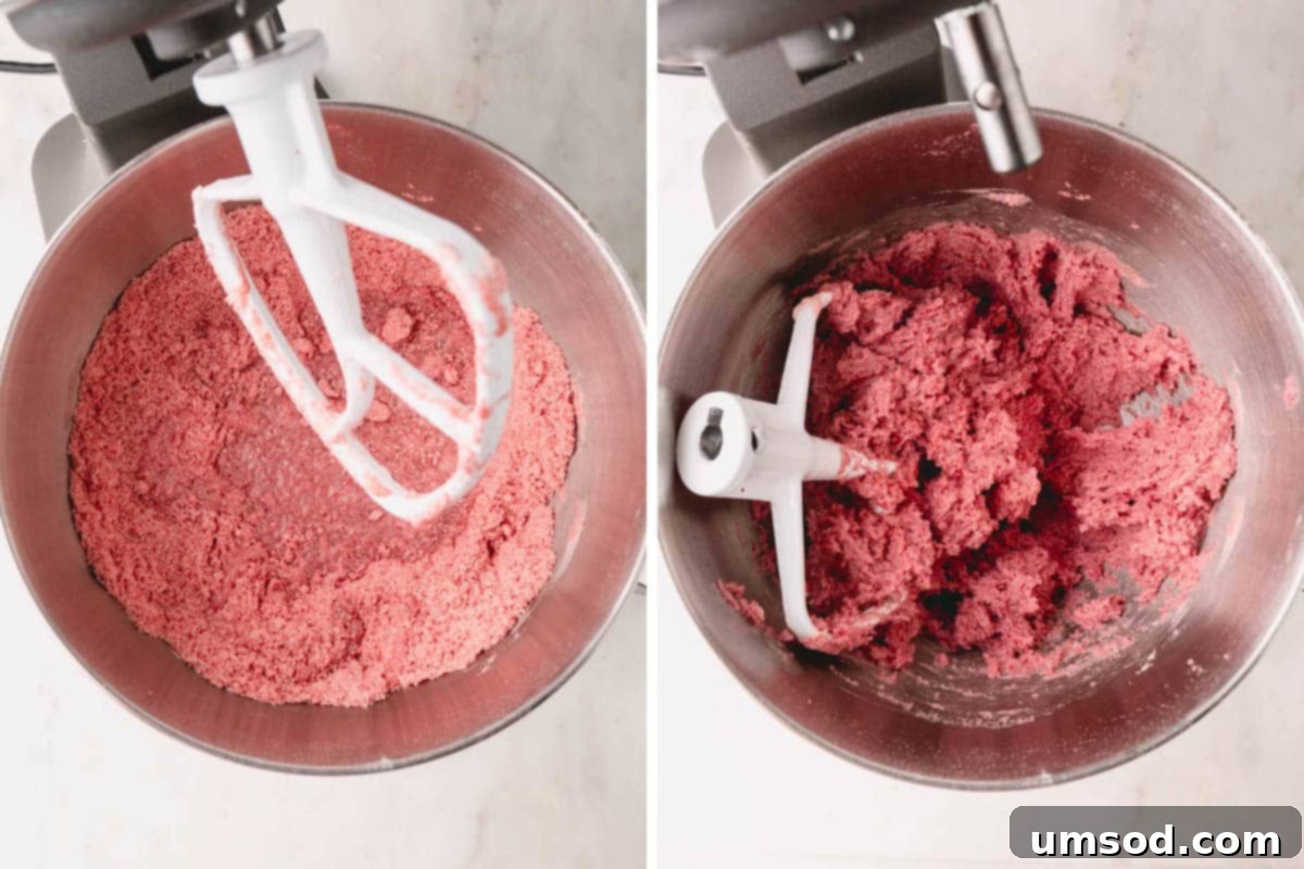 Berry Sweet Symphony 10 Strawberry cake batter being combined in a stand mixer with a whisk attachment.