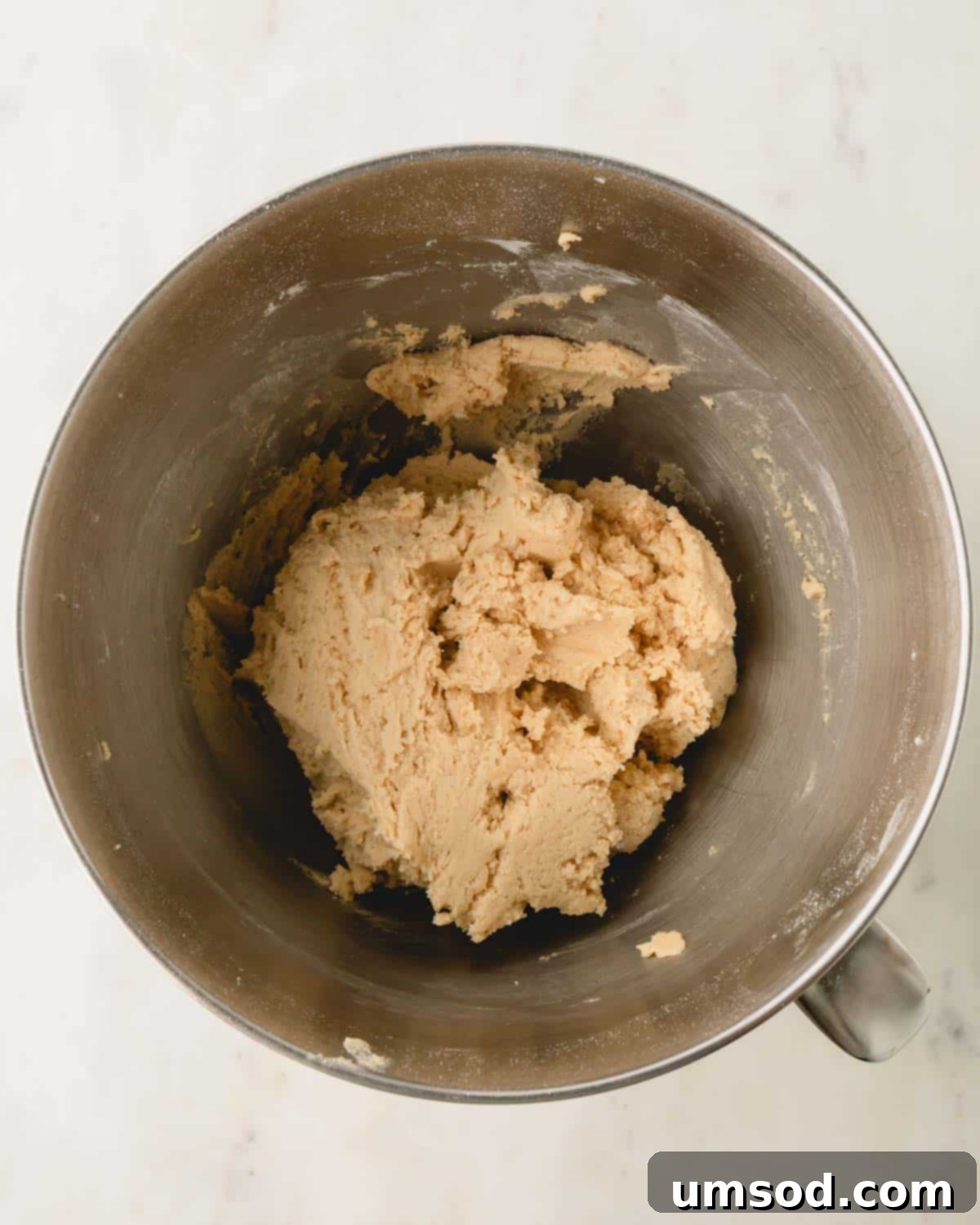 A smooth and well-mixed bowl of cookie dough.