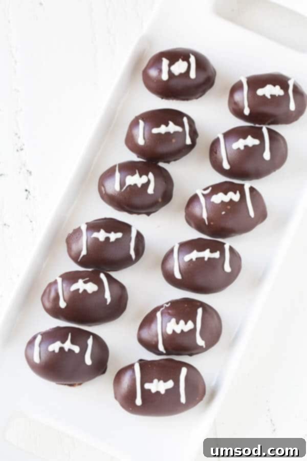 Gourmet Triple Chocolate Oreo Truffles 2 Triple Chocolate OREO Cookie Balls designed as footballs for game day dessert