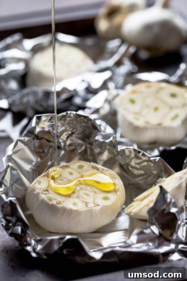 Crispy Garlic Breadsticks 3 A head of garlic, sliced horizontally to expose cloves, drizzled with olive oil, ready for roasting.