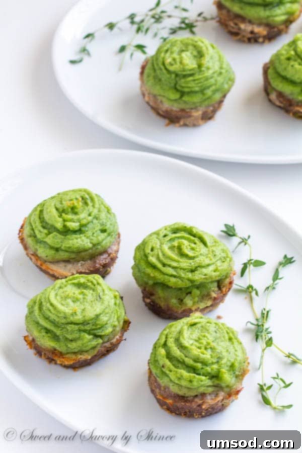 Delicious mini shepherd's pies with fluffy green mashed potato topping, perfect for St. Patrick's Day parties and celebrations.