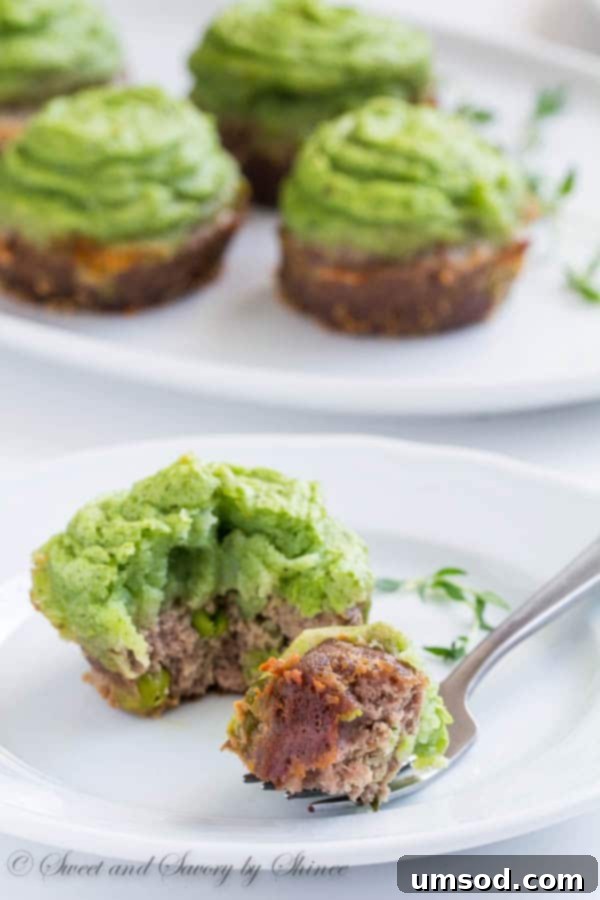 Close-up of baked mini shepherd's pies with vibrant green mashed potato topping, ready for a St. Patrick's Day celebration.
