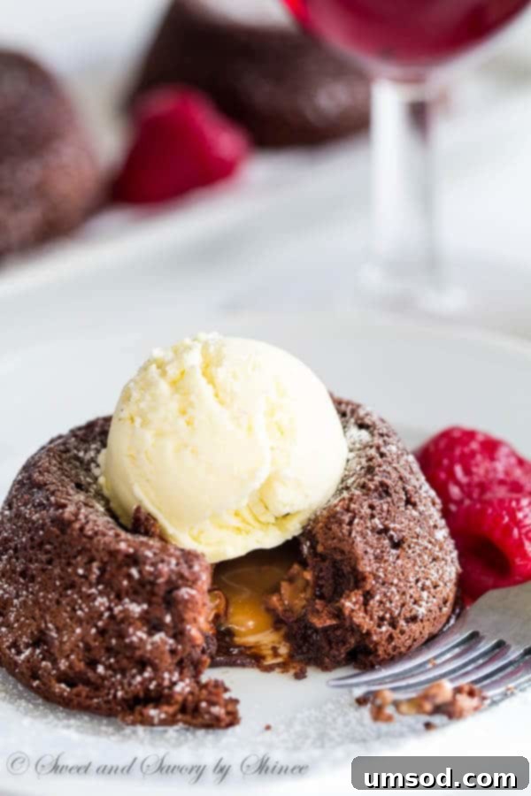 Gooey Caramel Lava Bites 6 Beautifully presented Mini Caramel Lava Cakes with fresh berries and vanilla ice cream, creating an inviting dessert.