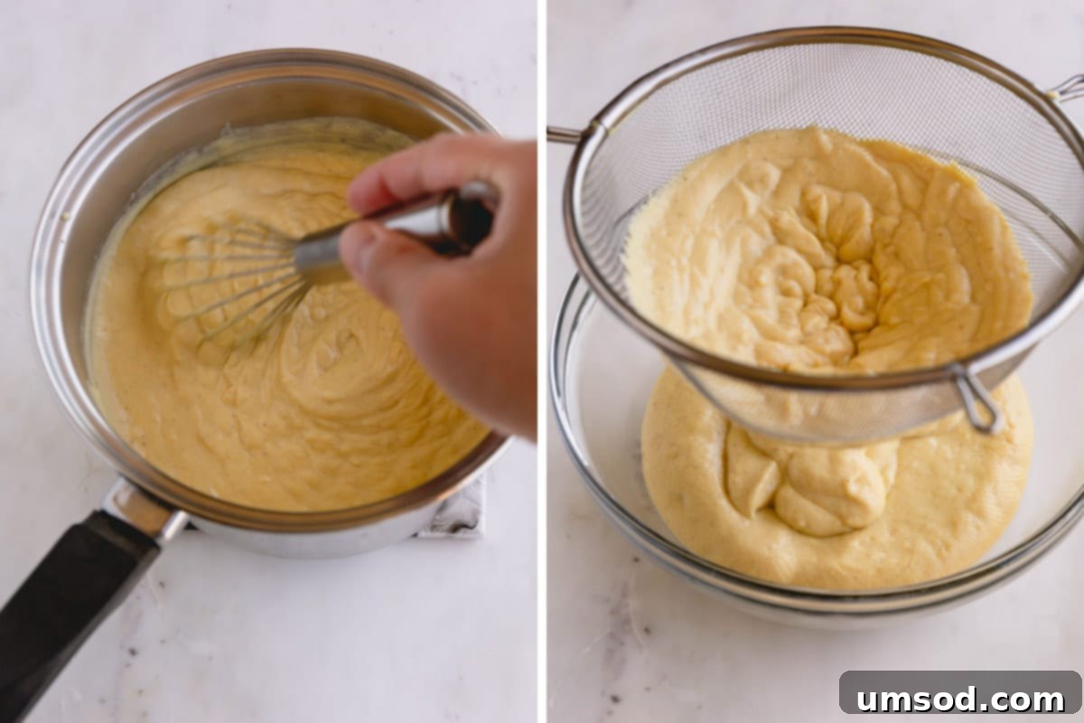 Vanilla pudding being strained through a fine mesh sieve.