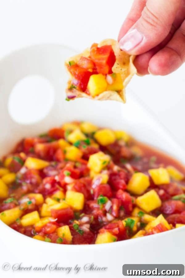 Platter of mango salsa served with tortilla chips, ready for a gathering